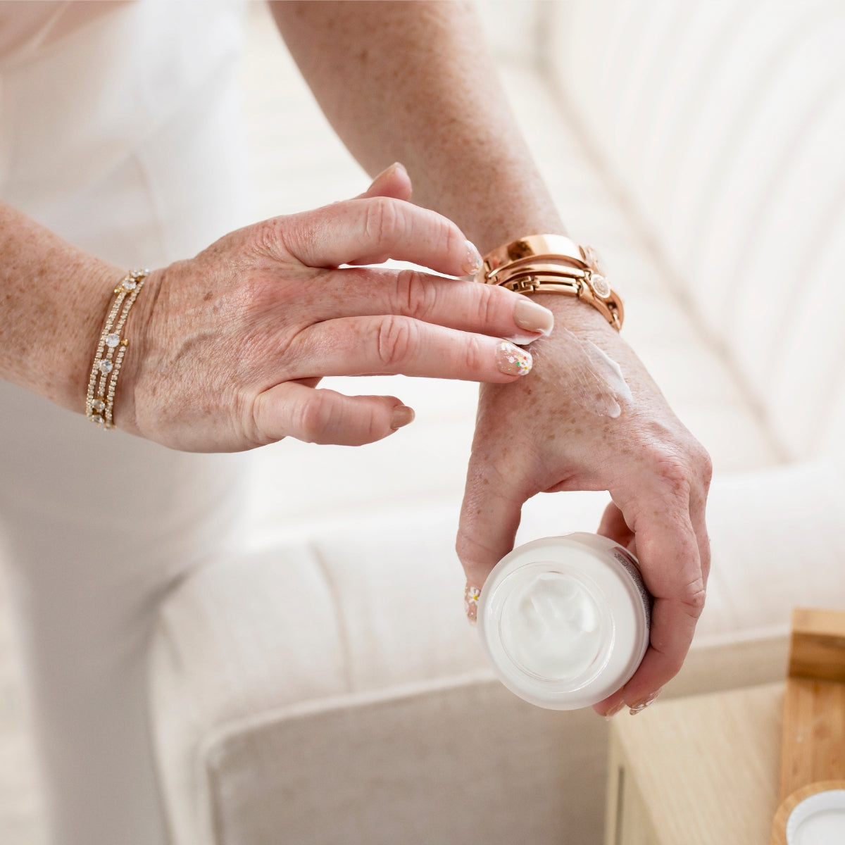 A closeup of Alana Palmer using the Konenki Skincare Complete Cream on her hand.