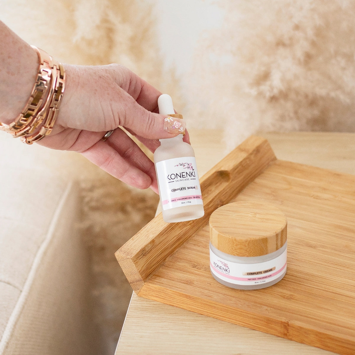 A closeup of Konenki Skincare founder, Alana Palmer, holding a bottle of the Konenki Complete Serum.