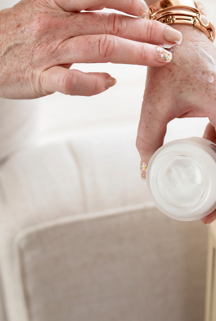 A closeup of Alana Palmer using the Konenki Skincare Complete Cream on her hand.